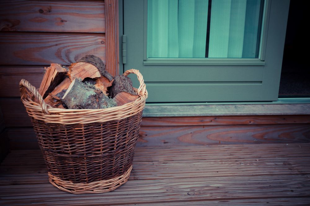 Wood Logs In Basket On Front Porch